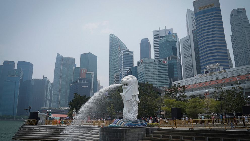 FILE - Merlion statue with the background of business district in Singapore, Saturday, Sept, 21, 2019. Singaporean man, Abdul Kahar Othman, 68, on death row for drug trafficking was hanged Wednesday, March 30, 2022, in the first execution in the city