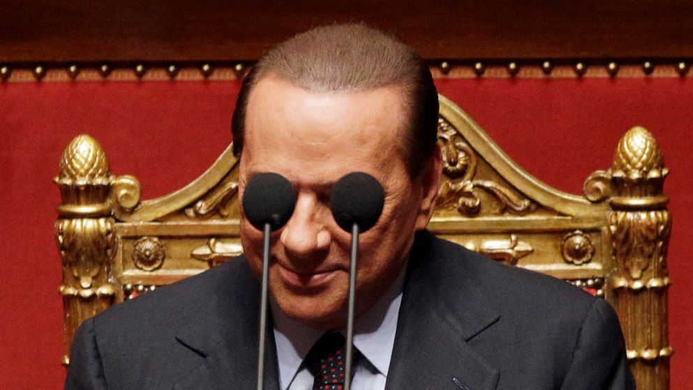 FILE - Italian Premier Silvio Berlusconi is framed by microphones prior to deliver his speech at the Italian Senate, Thursday, Sept. 30, 2010. Italy is poised to elect a new president, a figure who is supposed to serve as the nation's moral compass a
