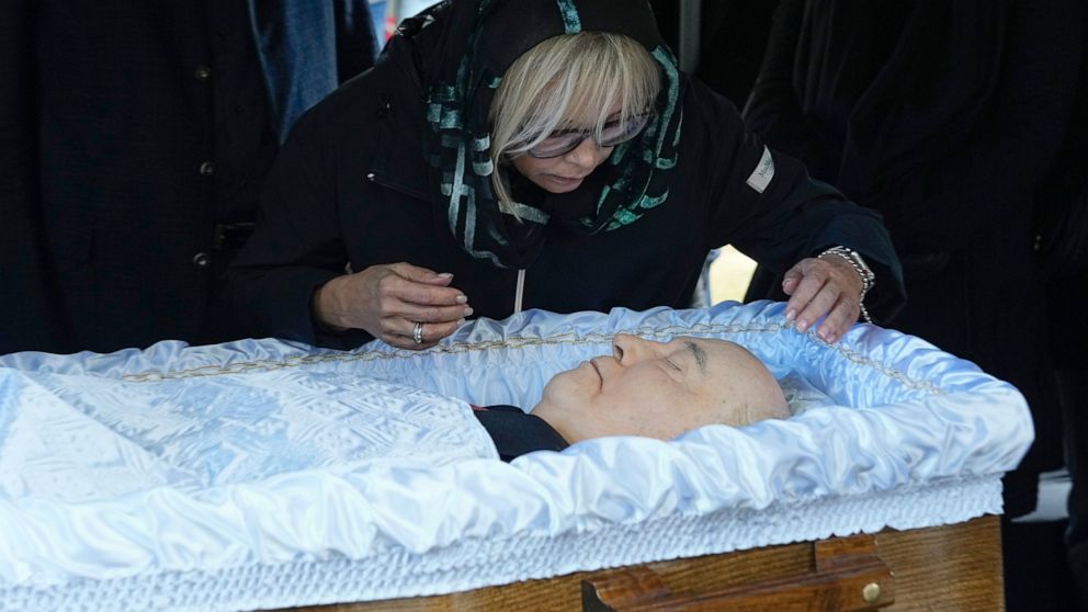 Irina Virganskaya, daughter of former Soviet Union President Mikhail Gorbachev says goodbye to him for the last time, during his funeral, at Novodevichy Cemetery in Moscow, Russia, Saturday, Sept. 3, 2022. Thousands of mourners lined up Saturday to p