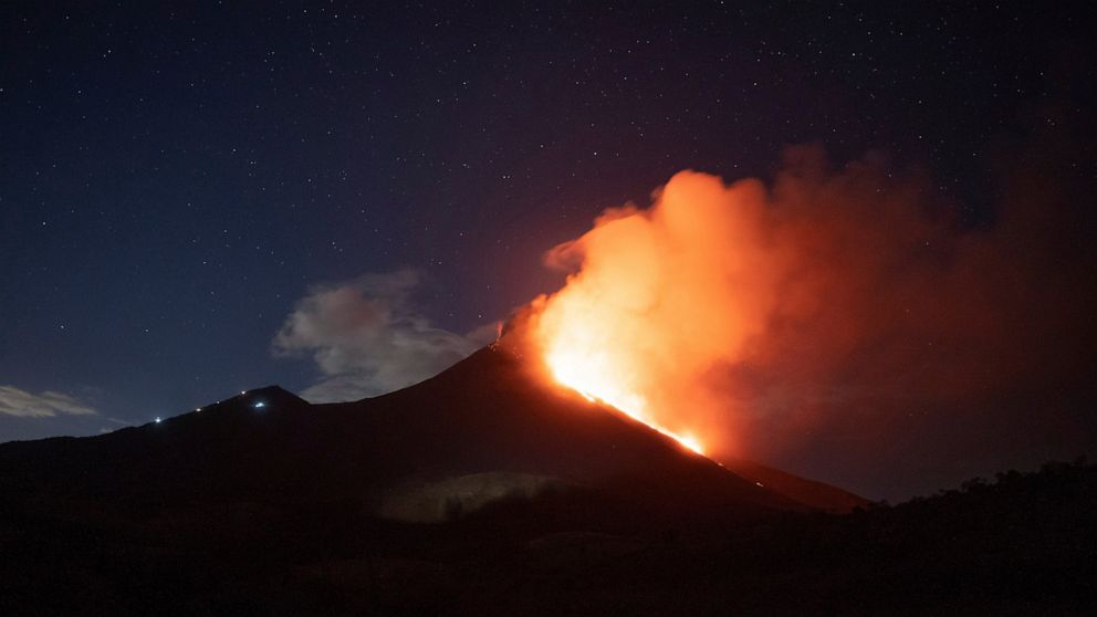 Pacaya volcano spews lava, viewed from San Vicente Pacaya, Guatemala, Wednesday, March 3, 2021. (AP Photo/Santiago Billy )