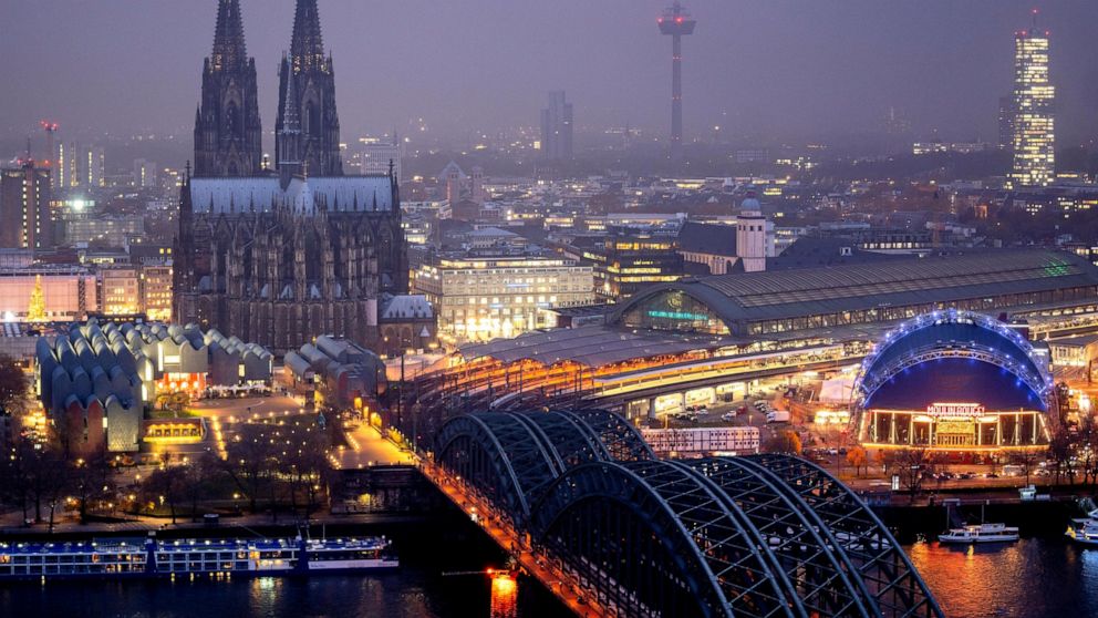 The illuminated city center with the Cathedral in Cologne, Germany, Tuesday, Nov. 29, 2022. An unprecedented crisis of confidence is shaking the Archdiocese of Cologne. Catholic believers have protested their deeply divisive bishop and are leaving in