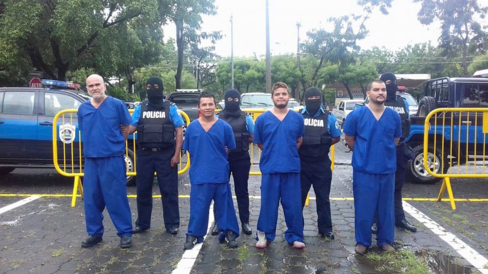 In this Oct. 17, 2018 photo, provided by the Nicaraguan National Police, prisoners detained and imprisoned during the recent uprisings against the government of President Daniel Ortega, are shown to the press in Managua, Nicaragua. At left is Eddy An