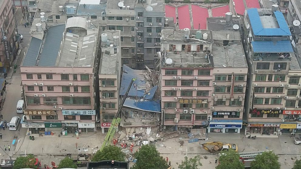 Police arrest 9 after building collapses in central China