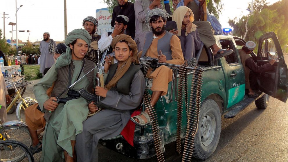 Taliban fighters patrol inside the city of Kandahar province southwest, of Afghanistan, Sunday, Aug. 15, 2021. (AP Photo/Sidiqullah Khan)