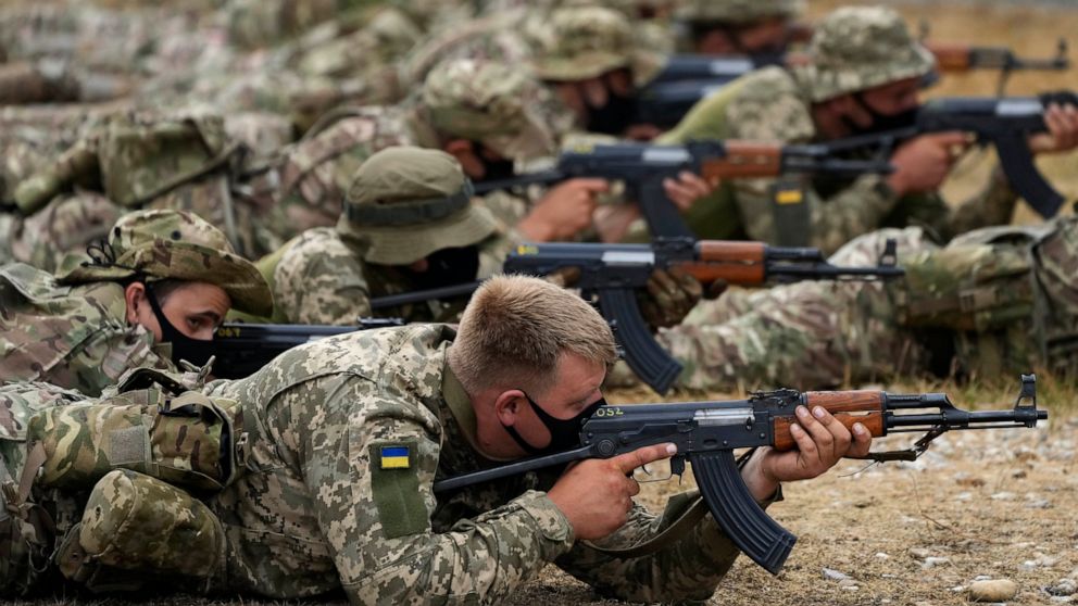 Ukrainian volunteer military recruits take part in an urban battle exercise whilst being trained by British Armed Forces at a military base in Southern England, Monday, Aug. 15, 2022. MOD and British Army as the UK Armed Forces continue to deliver in