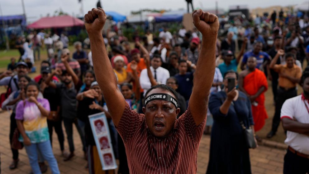 Protesters shout slogans demanding elected president Ranil Wickremesinghe step down during a protest at the presidential secretariat premise in Colombo, Sri Lanka, Wednesday, July 20, 2022. Sri Lanka's prime minister was elected president Wednesday b