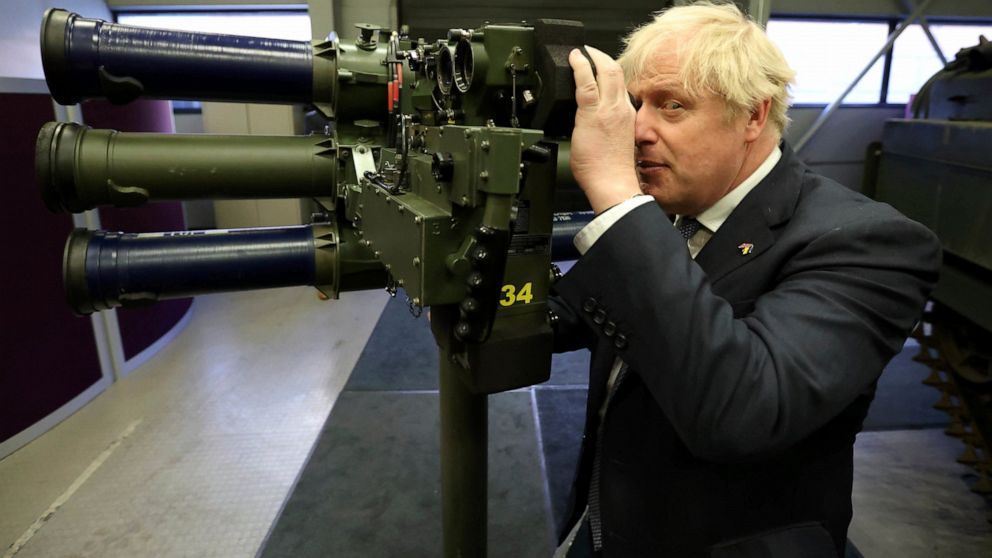 Britain's Prime Minister Boris Johnson with a Mark 3 shoulder launch LML (Lightweight Multiple Launcher) missile system, at Thales weapons manufacturer in Belfast, Monday May 16, 2022, during a visit to Northern Ireland. Johnson said there would be “