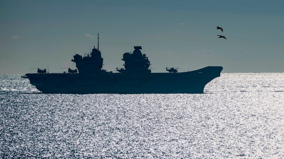 FILE - In this Feb. 9, 2018, file photo, the 65,000-tonne HMS Queen Elizabeth, the largest warships ever built for the Royal Navy of the United Kingdom, arrives at the British territory of Gibraltar. New aircraft carrier HMS Queen Elizabeth, the most