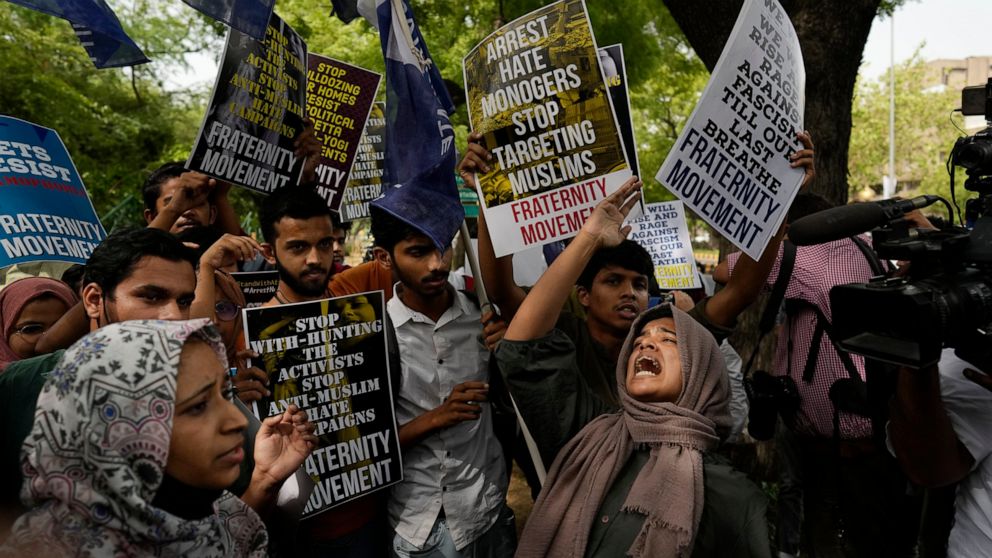 Muslim students shout anti government slogans during a protest outside Uttar Pradesh house, in New Delhi, Monday, June 13, 2022. The students were protesting against persecution of Muslims and recent demolition of their houses following last week's p