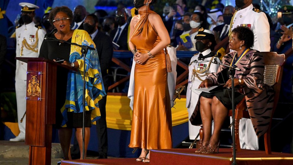 Barbados' Prime Minister Mia Mottley, left, and President of Barbados, Dame Sandra Mason, right, honour Rihanna as a National Hero, during the Presidential Inauguration Ceremony, at Heroes Square, in Bridgetown, Barbados, Tuesday, Nov. 30, 2021. Barb