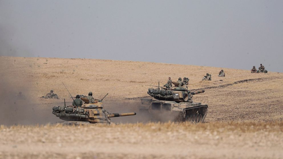 Turkish tanks and troops stationed near Syrian town of Manbij, Syria, Tuesday. Oct. 15, 2019. Russia moved to fill the void left by the United States in northern Syria on Tuesday, deploying troops to keep apart advancing Syrian government and Turkish