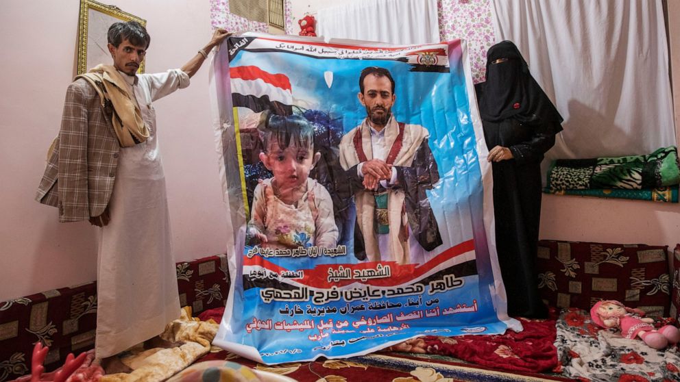 A father and daughter's grave marks the cost of Yemen's war
