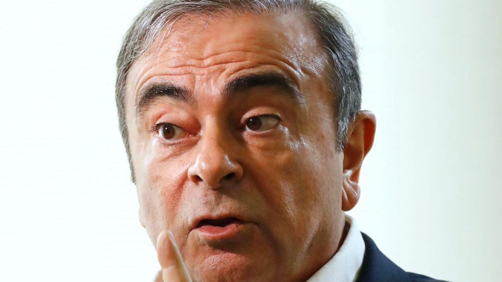 Former Nissan Chairman Carlos Ghosn speaks to Japanese media during an interview in Beirut, Lebanon, Friday, Jan. 10, 2020. A lawyer for Carlos Ghosn, Nissan's former chairman who skipped bail in Japan and fled to Lebanon, on Friday slammed a gaffe b