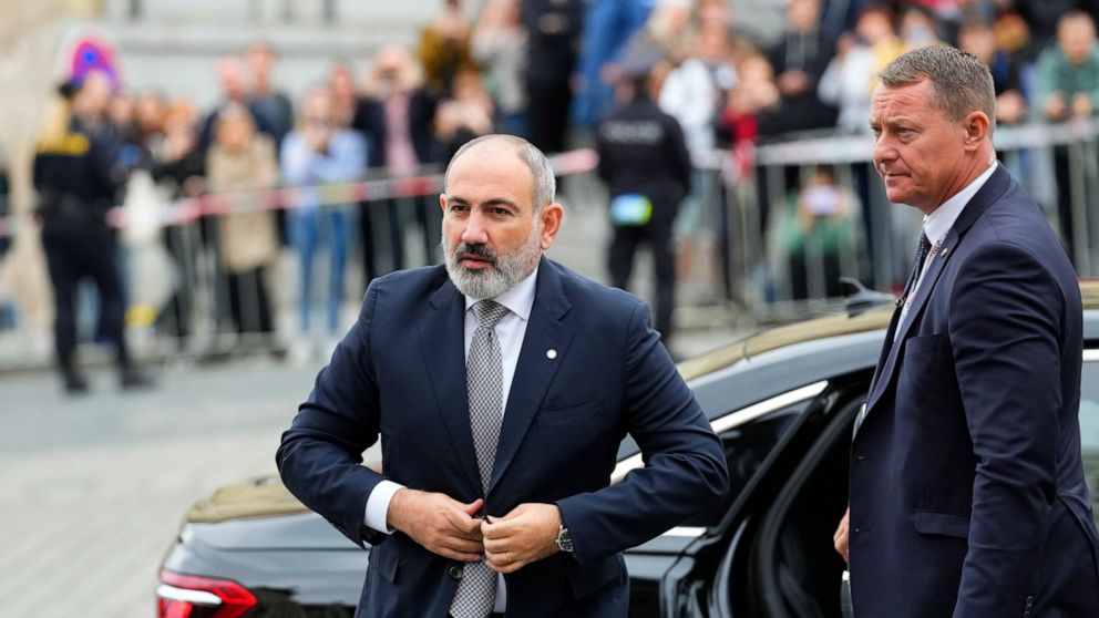 Armenia's Prime Minister Nikol Pasjinian, left, arrives for a meeting of the European Political Community at Prague Castle in Prague, Czech Republic, Thursday, Oct 6, 2022. Leaders from around 44 countries are gathering Thursday to launch a "European