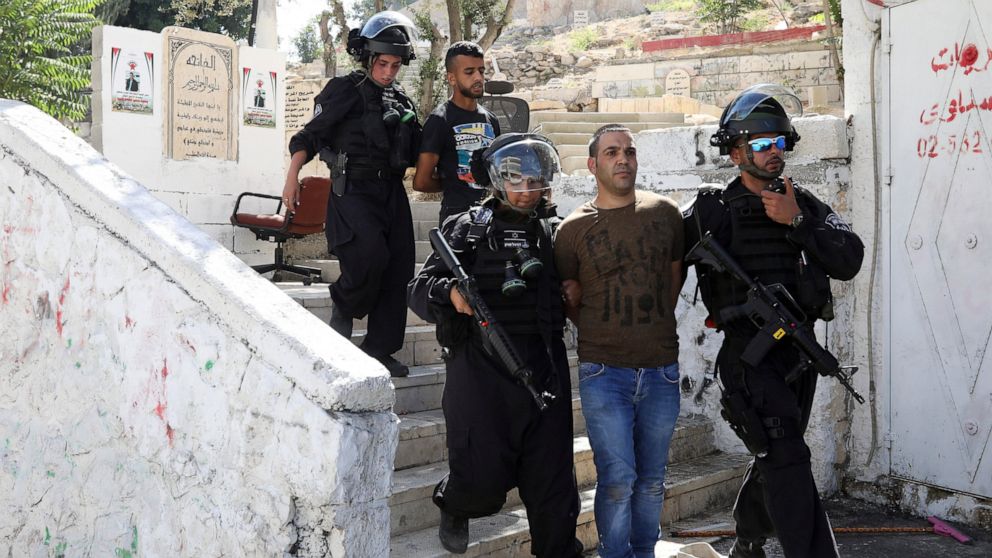 FILE - In this June 28, 2019 file photo, Israeli police arrest a Palestinian during clashes the Palestinian neighborhood of Issawiya in East Jerusalem, a day after a Palestinian was shot and killed by police during a protest in the same neighborhood.
