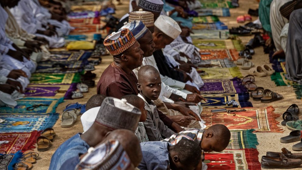 Muslims make traditional Friday prayers at a mosque near to the Emir's palace in Kano, northern Nigeria Friday, Feb. 15, 2019. Nigeria is due to hold general elections on Saturday, pitting incumbent President Muhammadu Buhari against leading oppositi