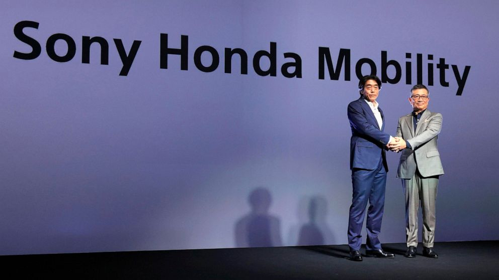 Izumi Kawanishi, left, the Sony executive who became Chief Operating Officer at Sony Mobility and Chief Executive Yasuhide Mizuno pose for a photo during a news conference in Tokyo Thursday, Oct. 13, 2022. A new electric car company that brings toget