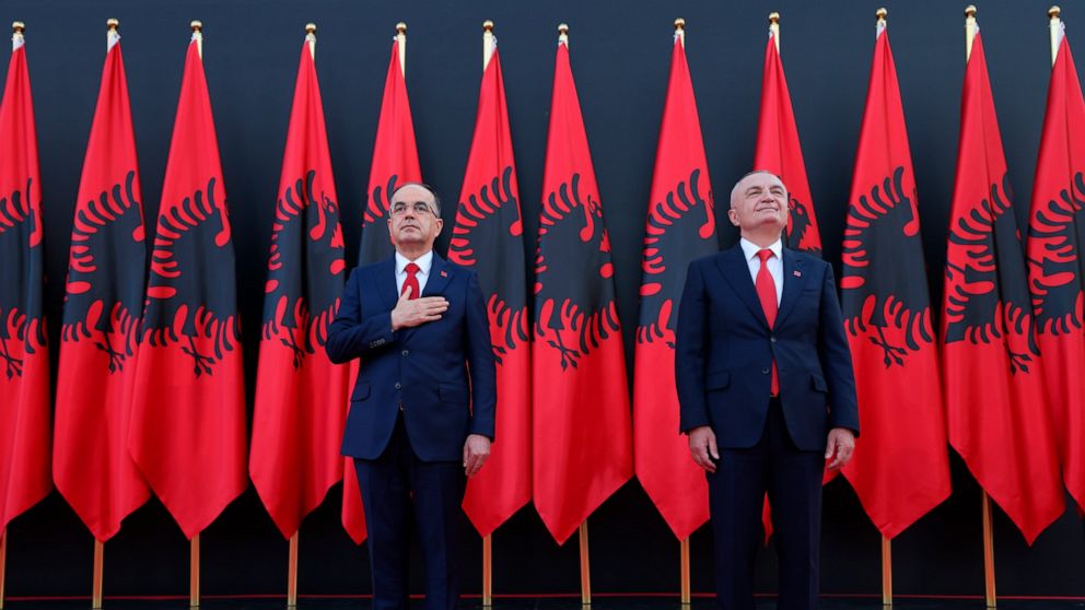 Newly appointed Albanian President Bajram Begaj, left, stands next to former President Ilir Meta, during an inauguration ceremony at the Presidential palace, in Tirana, Sunday, July 24, 2022. Albania's new president sworn in on Sunday calling on the 