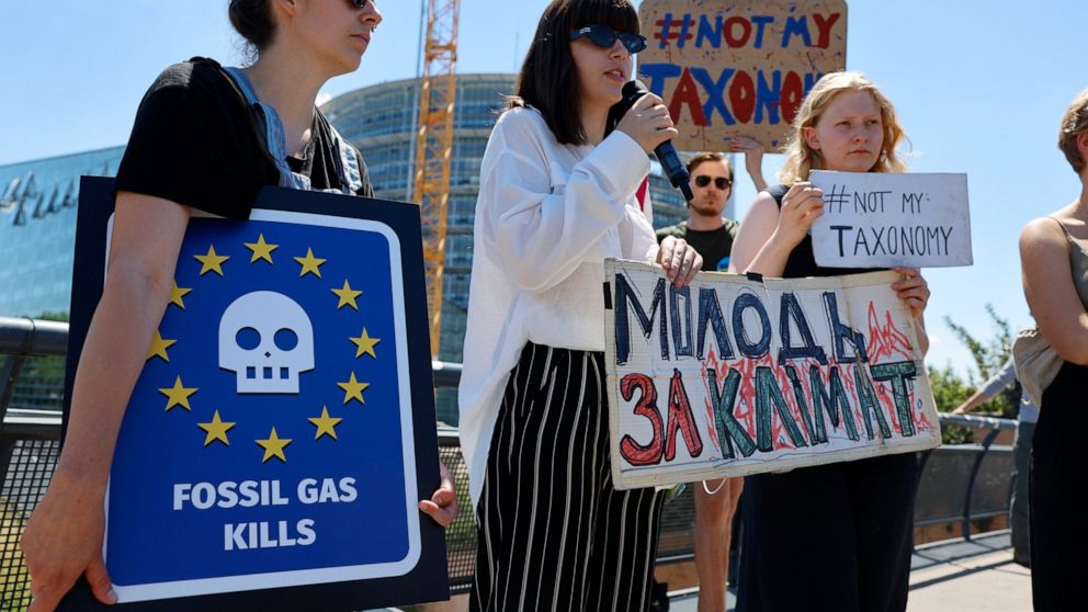 Climate activists demonstrate outside the European Parliament , Tuesday, July 5, 2022 in Strasbourg, eastern France. The European Parliament will decide Wednesday whether to accept or reject the Commission's proposal to classify gas and nuclear power