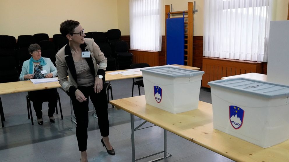 Slovenians vote in tight race between populists, liberals