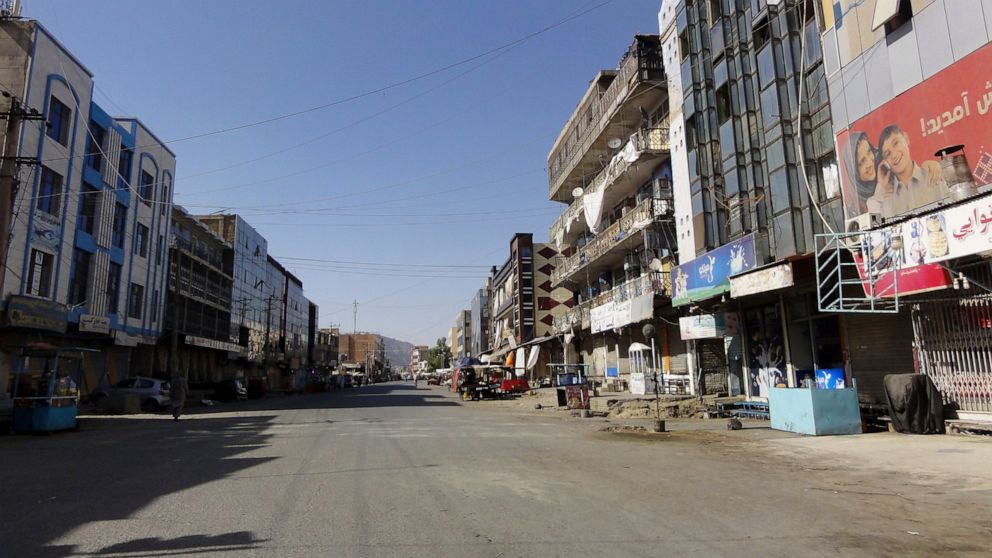 A market is shuttered closed over security fears during fighting between the Taliban and Afghan security personnel, in Kandahar, southwest of Kabul, Afghanistan, Thursday, Aug. 12, 2021. (AP Photo/Sidiqullah Khan)