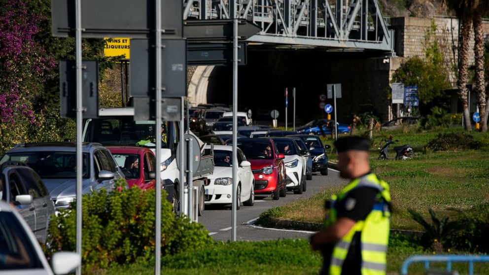 Cars line up for police checks before entering France from Italy at a border crossing in Menton, southern France, Sunday, Nov. 13, 2022. Lines formed Sunday at one of Italy’s northern border crossings with France following Paris’ decision to reinforc