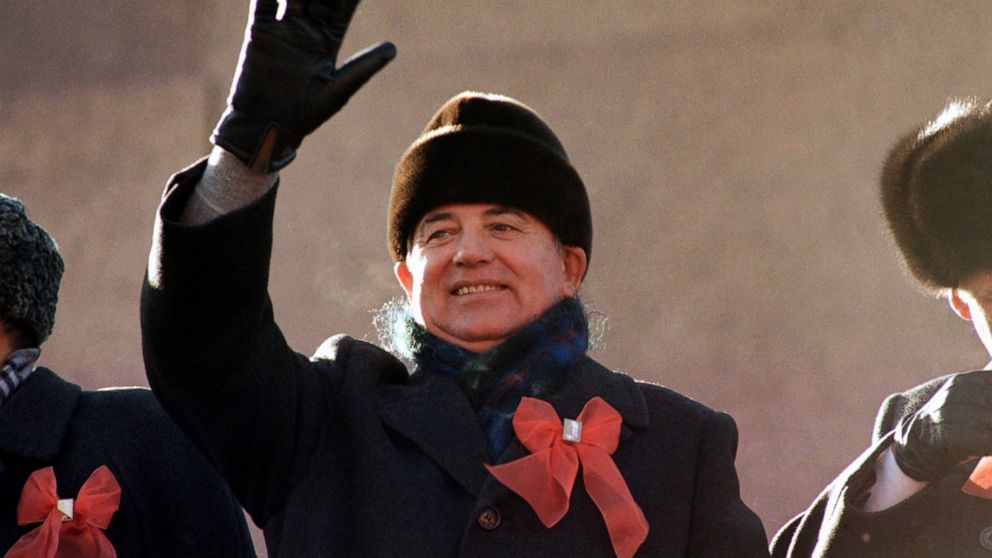 FILE - Soviet leader Mikhail Gorbachev waves from the parade review stand of the Lenin Mausoleum on Saturday, Nov. 7, 1987 in Moscow' s Red Square during the 70th anniversary of the Russian Revolution. Russian news agencies are reporting that former 