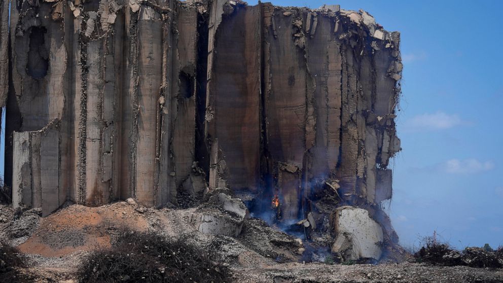 The north block of the Beirut Port silos, already damaged in the August 2020 port blast, has caught fire due to fermented grain and is at risk of collapse, in Beirut, Lebanon, Thursday, July 14, 2022. Lebanese caretaker Economy Minister Amin Salam sa