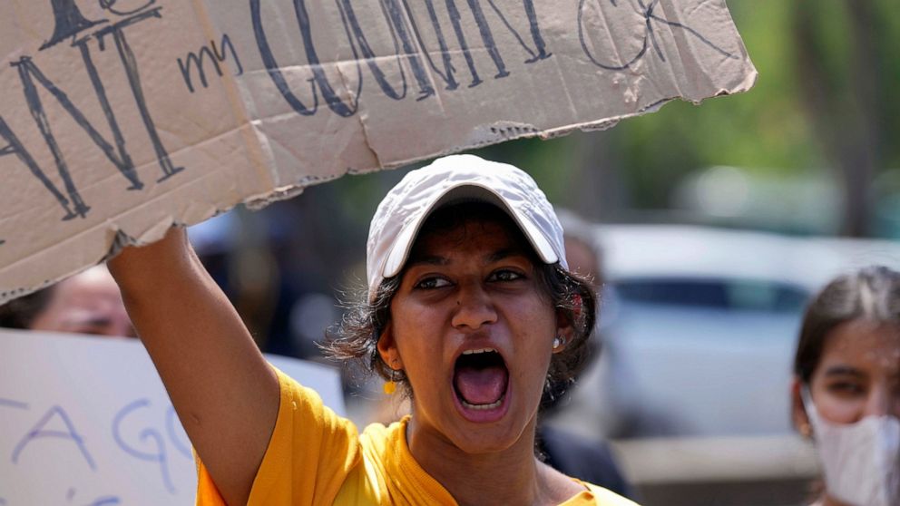 Sri Lankan youth shout anti government slogans during a protest demanding president Gotabaya Rajapaksa resign in Colombo, Sri Lanka, Monday, April 4, 2022. Sri Lanka’s president on Monday invited all political parties represented in Parliament to acc