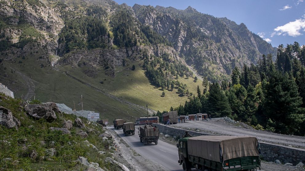 FILE - In this Sept. 9, 2020, file photo, an Indian army convoy moves on the Srinagar- Ladakh highway at Gagangeer, northeast of Srinagar, Indian-controlled Kashmir. China on Tuesday called India’s designation of the region along their disputed borde