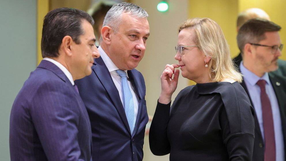 From left, Greek Energy Minister Kostas Skrekas and Czech Energy Minister Jozef Sikela speak with Polish Minister of Climate and Environment Anna Moskwa prior to a meeting of EU energy ministers at an extraordinary energy council in Brussels, Thursda