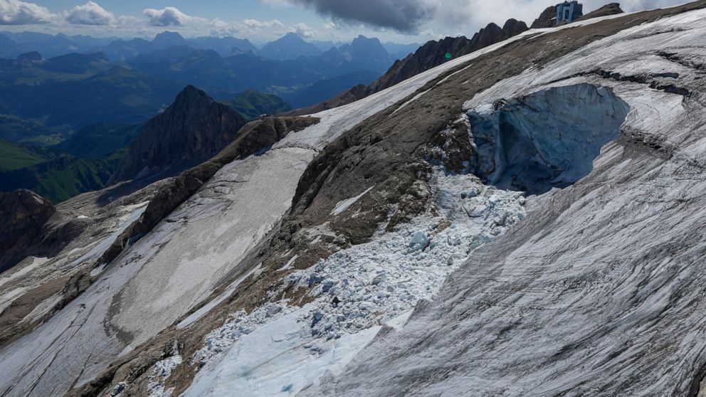 A view taken from a rescue helicopter of the Punta Rocca glacier near Canazei, in the Italian Alps in northern Italy, Tuesday, July 5, 2022, two days after a huge chunk of the glacier broke loose, sending an avalanche of ice, snow, and rocks onto hik