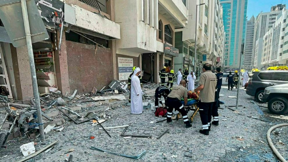 In this photo released by the Abu Dhabi Police, debris covers the street after an explosion in the Khalidiya district of Abu Dhabi, United Arab Emirates, Monday, May 23, 2022. A gas cylinder explosion in the capital of the United Arab Emirates killed