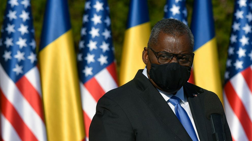 U.S. Defense Secretary Lloyd Austin stands during a joint press conference with Romanian Defense Minister Nicolae Ciuca during a welcoming ceremony in Bucharest, Romania, Wednesday, Oct. 20, 2021. Austin is visiting Romania before attending the NATO 