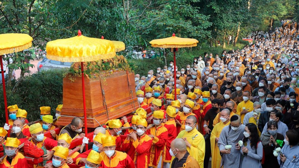 Coffin of Vietnamese Buddhist monk Thich Nhat Hanh is carried to the street during his funeral in Hue, Vietnam Saturday, Jan. 29, 2022. A funeral was held Saturday for Thich Nhat Hanh, a week after the renowned Zen master died at the age of 95 in Hue