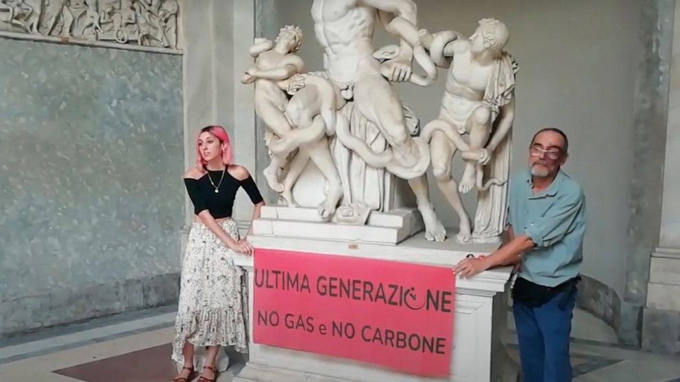 A video grab from a footage made available by environmental activists, shows two members of Ultima Generazione, or Last Generation in English, glued their hands on the Roman statue of Laocoön and His Sons, one of the masterpieces of the Vatican Museu