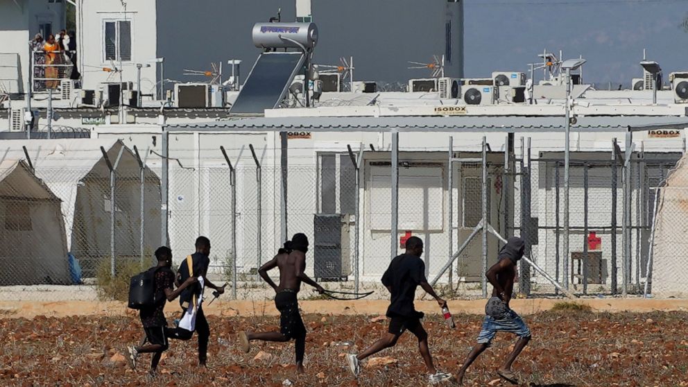 Fighting erupts at Cyprus migrant camp; 2 hurt, tents ablaze - ABC News