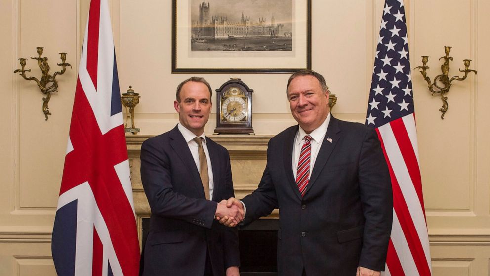 UK Foreign Secretary Dominic Raab shakes hands with US Secretary of State Mike Pompeo, right, in London, Wednesday Jan. 29, 2020. Pompeo is in the UK for high level trade talks ahead of Britain's exit from the European Union on upcoming Friday. (Pete