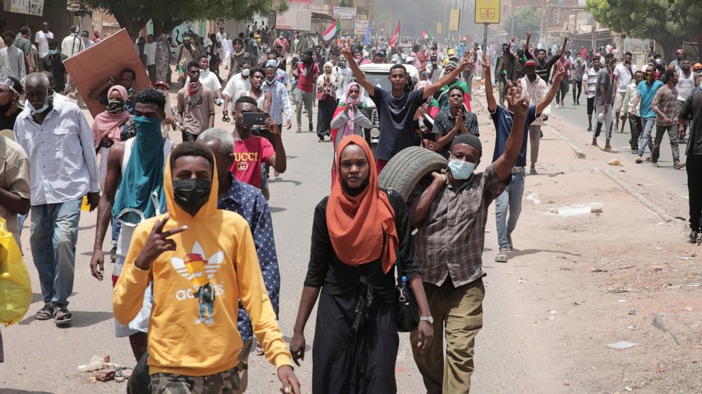Sudanese anti-military protesters march in demonstrations in the capital of Sudan, Khartoum, on Thursday, June 30, 2022. A Sudanese medical group says multiple people were killed on Thursday in the anti-coup rallies during which security forces fired