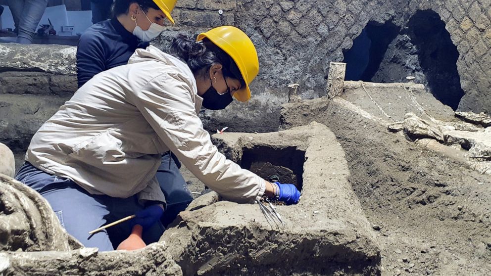 Archeologist clean up their latest finding in Pompeii, Italy. Archeologists, excavating a villa amid the ruins of the 79 A.D. volcanic eruption, have discovered a room that served as both a dormitory and storage area, which officials said Saturday of