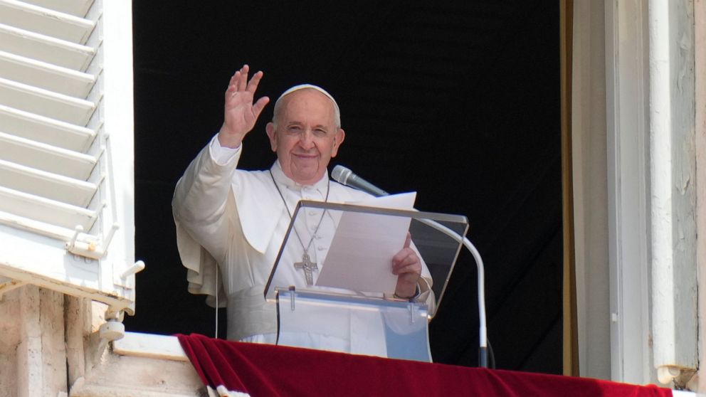 Pope Francis waves to the crowd as he arrives to recite the Angelus noon prayer from the window of his studio overlooking St.Peter's Square, at the Vatican, Sunday, July 4, 2021. (AP Photo/Alessandra Tarantino)