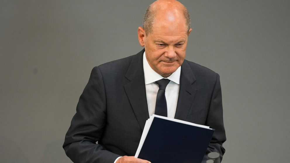 German Chancellor Olaf Scholz leaves the podium after his speech at the German parliament Bundestag at the Reichstag building in Berlin, Germany, Wednesday, June 22, 2022. (AP Photo/Markus Schreiber)