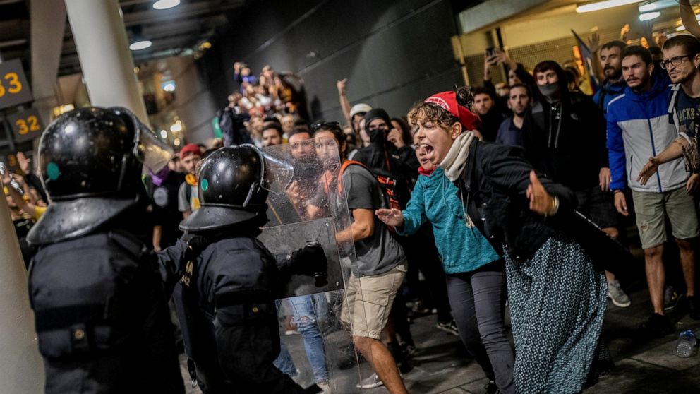 AP PHOTOS: Riot police clash with protesters in Barcelona ...