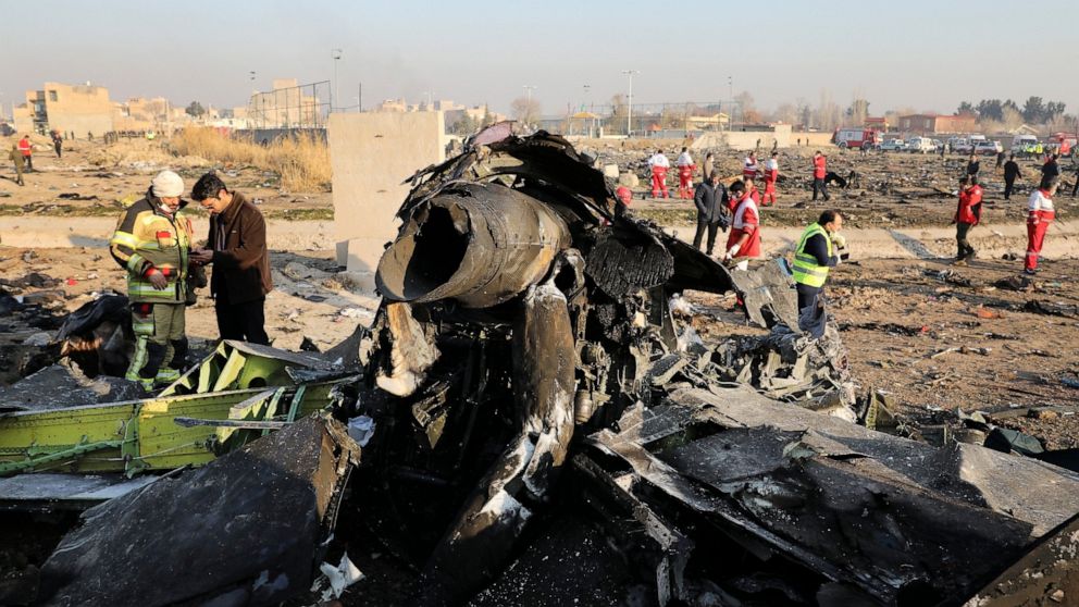 FILE - In this Wednesday, Jan. 8, 2020 file photo, debris at the scene where a Ukrainian plane crashed in Shahedshahr southwest of the capital Tehran, Iran. Iran announced Saturday, Jan. 11, that its military “unintentionally” shot down the Ukrainian