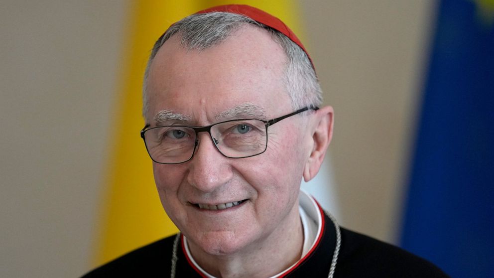 FILE - Vatican Secretary of State Cardinal Pietro Parolin smiles as he is welcomed by German President Frank-Walter Steinmeier for a meeting at the Bellevue palace in Berlin, Germany on June 29, 2021. The European Commission on Tuesday Nov. 30, 2021,