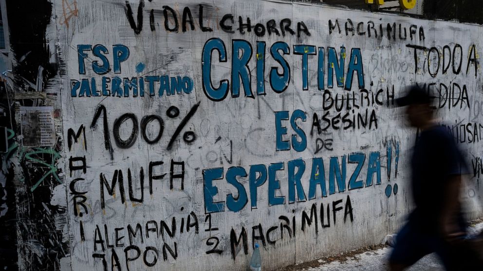 A man walks next to a graffiti that reads in Spanish: "Cristina is hope", in reference to Vice President Cristina Kirchner, in Buenos Aires, Argentina, Monday, Dic. 5, 2022. A judge will determine Tuesday whether to sentence Cristina Kirchner for all