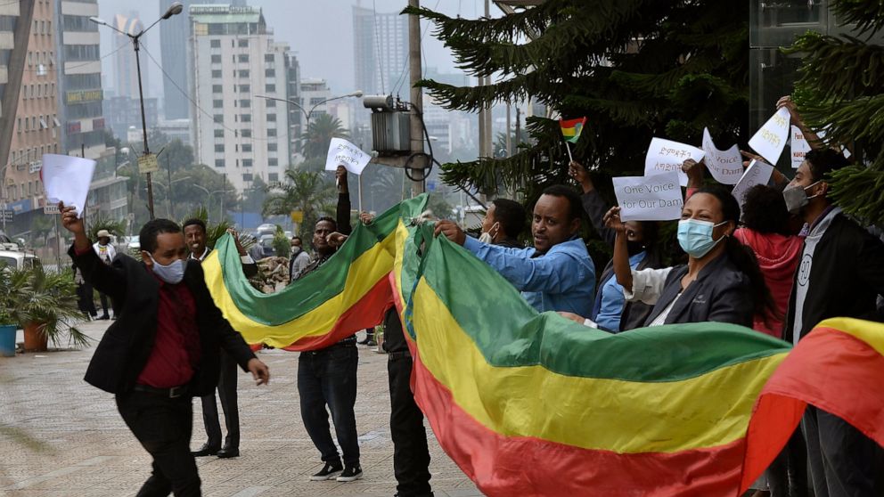Ethiopians celebrate the progress made on the Nile dam, in Addis Ababa, Ethiopia, Sunday Aug. 2, 2020. Ethiopians in the capital celebrated the progress in the construction of the country’s dam on the Nile River, which has caused regional controversy