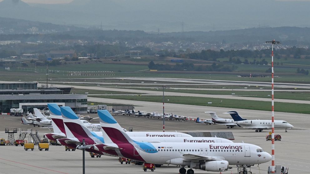 Eurowings aircrafts are parked at the airport in Stuttgart, Germany, Thursday, Oct. 6, 2022. A pilots strike at budget airline Eurowings has forced the German carrier to cancel hundreds of flights Thursday. The airline said about half of its 500 dail