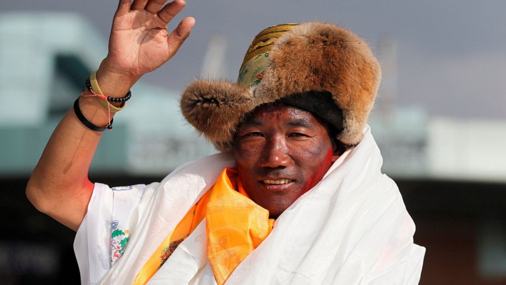 Sherpa guide scales Mount Everest for record 25th time