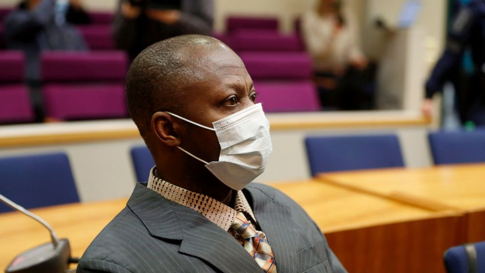 Sierra Leonean national Gibril Massaquoi, 51, wears a face mask as he attends his trial at the Pirkanmaa District Court in Tampere, Finland, Wednesday Feb. 3, 2021, accused of committing war crimes during Liberia's second civil war two decades ago. M
